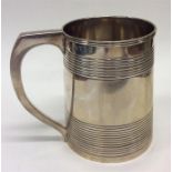 A Georgian silver pint tankard decorated with reed