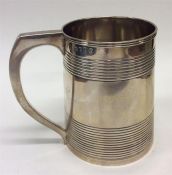 A Georgian silver pint tankard decorated with reed