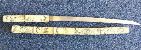 A large Antique carved ivory sword, the body decor