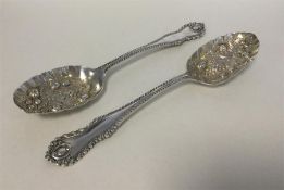 A good pair of silver berry spoons with fancy fini