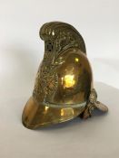 A heavy brass Merryweather Fireman's helmet. Est.