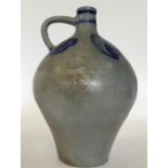 A large French Delft flagon in blue-ground with lo