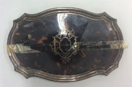 A silver and tortoiseshell dressing table tray wit