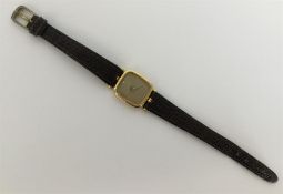 OMEGA: A lady's small 18 carat wristwatch with gil