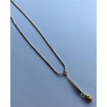 A 9 carat snake-link necklace with nugget drop. Ap