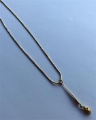 A 9 carat snake-link necklace with nugget drop. Ap