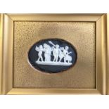 A Wedgwood black Jasper oval plaque finely modelle