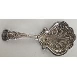 A fancy scroll decorated silver caddy spoon with s