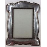 A stylish Arts and Crafts silver picture frame wit