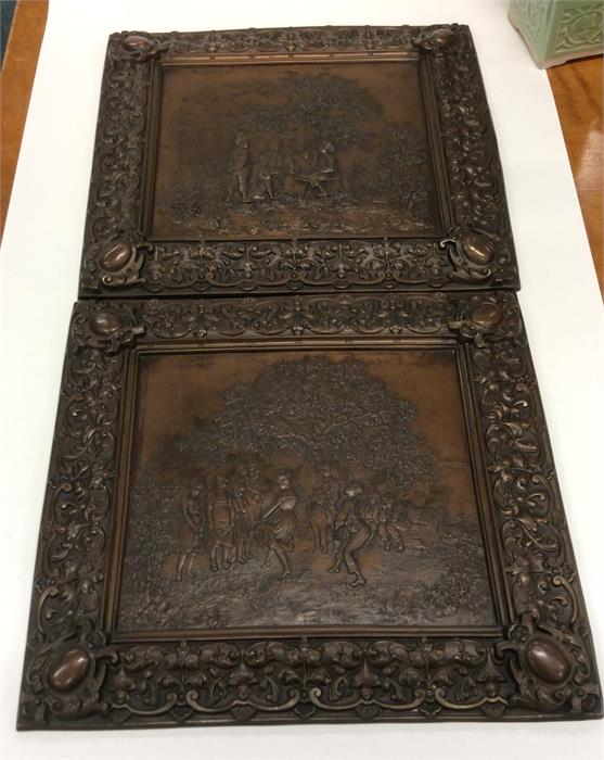 A good pair of cast iron embossed plaques depictin