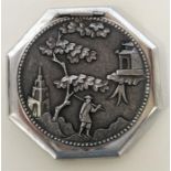 A heavy Chinese silver compact with figures under