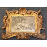 An attractive Continental gilt mirror decorated wi