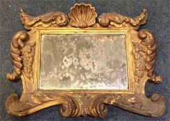 An attractive Continental gilt mirror decorated wi