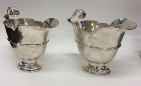 A pair of silver Georgian-style sauce boats with c