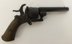 An Antique pin capped revolver with mahogany handl