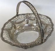 A Georgian silver basket attractively decorated wi