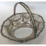 A Georgian silver basket attractively decorated wi