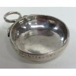 An early silver bleeding bowl with serpent handle.