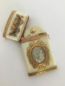 An Antique gold mounted and enamel card case decor