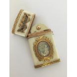 An Antique gold mounted and enamel card case decor