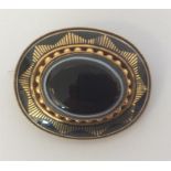 A high carat gold oval agate and enamelled target