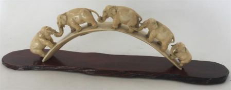 An Edwardian carved ivory bridge mounted with five
