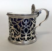 A Victorian silver mustard pot with pierced body,