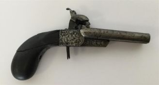 A small double-barrel starting pistol with hammere