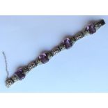 SUFFRAGETTE: A silver-mounted stylish bracelet wit