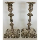 A pair of Victorian silver candlesticks with shape