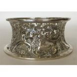 An unusual silver chased and embossed dish ring de