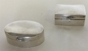 Two modern silver hinged top pill boxes. Approx. 1