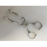 A pair of Georgian silver scissor-action sugar nip