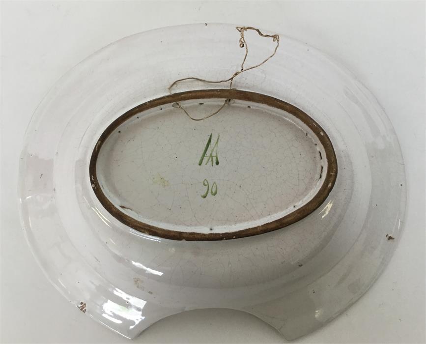 A Faience barber's bowl brightly painted with a cr - Image 2 of 2
