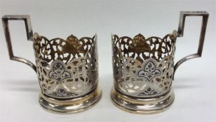 A pair of Russian silver gilt and enamel cup holde