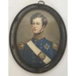 An oval miniature of a soldier in blue jacket, wit