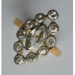 An attractive marquise cluster ring, the large cen