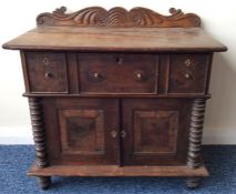 A Regency rosewood specimen cabinet with scroll de