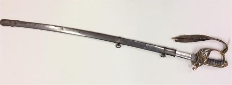 An Antique brass Military sword contained within a