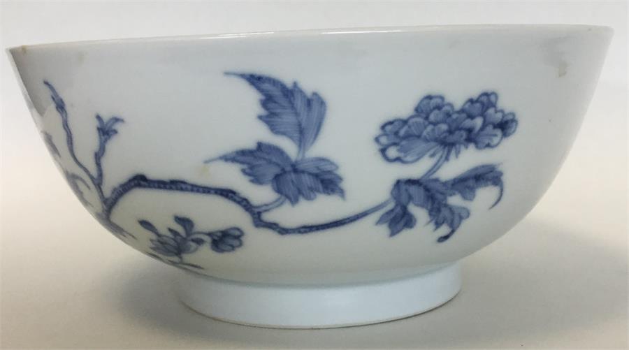 A Chinese porcelain blue and white bowl painted with flowering