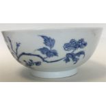 A Chinese porcelain blue and white bowl painted with flowering