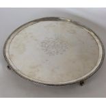 A massive circular George II silver salver with be