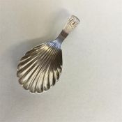 A Georgian silver caddy spoon with fluted bowl. Lo