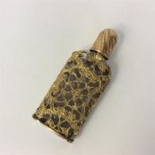 A good gilt scent bottle attractively decorated wi