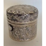 A heavy cylindrical embossed silver ink pot with s