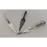 A group of three silver bookmarks in the form of t