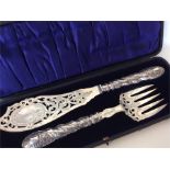 A pair of good quality silver fish servers, the bl