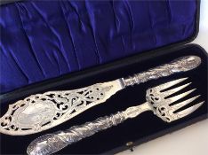 A pair of good quality silver fish servers, the bl