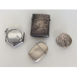 A small embossed silver menu holder together with