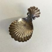 A Georgian silver fluted caddy spoon with shell th